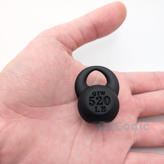 Small black weight plate held in a hand with 'OzConic' branding.
