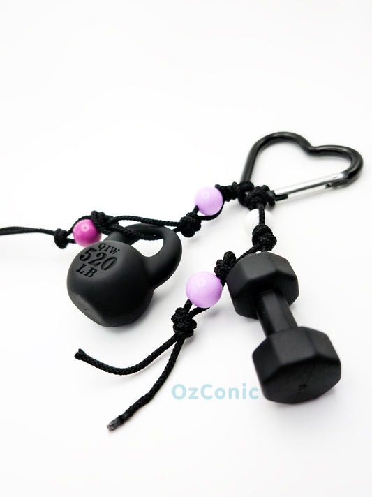 Black dumbbell and heart-shaped weight with pink beads