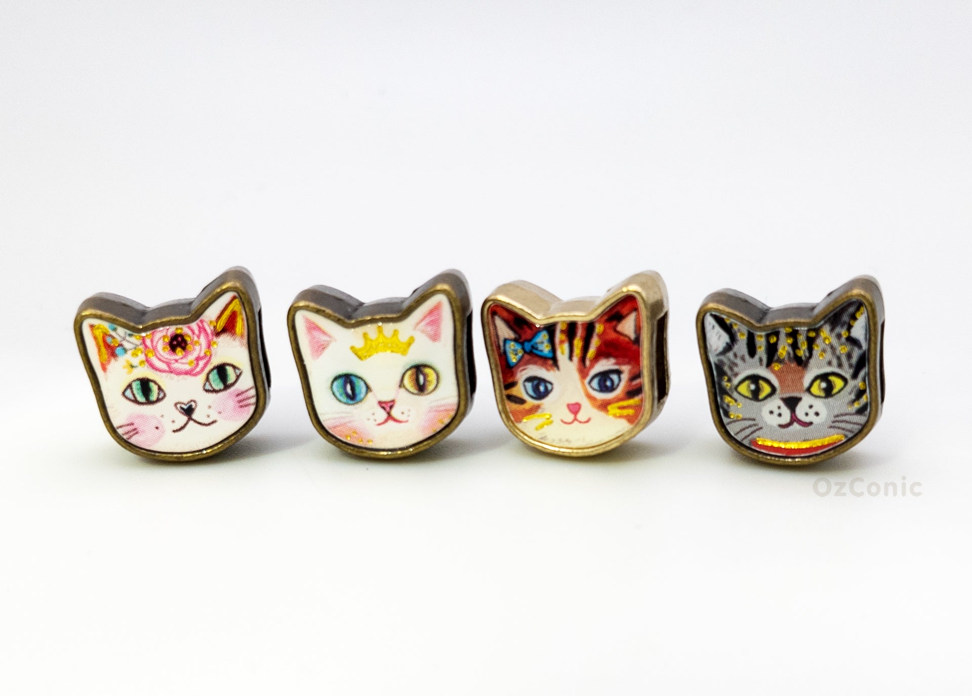Four cat-shaped charms